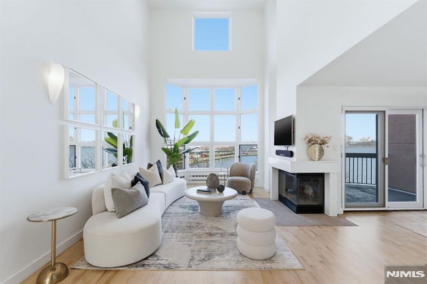 Elevated waterfront living with iconic NYC skyline and Hudson River views. This beautifully updated 3 bedroom, 2.5 bath townhouse spans over aprox 1,769 square feet and features a striking two story family room with floor to ceiling windows that bring the outdoors in. Set within a private 24 hour gated community, enjoy access to resort style amenities including a clubhouse, pool, tennis/pickleball courts, fitness center, park and dog park. Effortless commuting with a ferry shuttle and NJ Transit bus within walking distance, plus an array of nearby shops and dining. Pairing chic living with luxury amenities all just steps from the best of Edgewater. Truly a dream opportunity that wonâ€™t last.