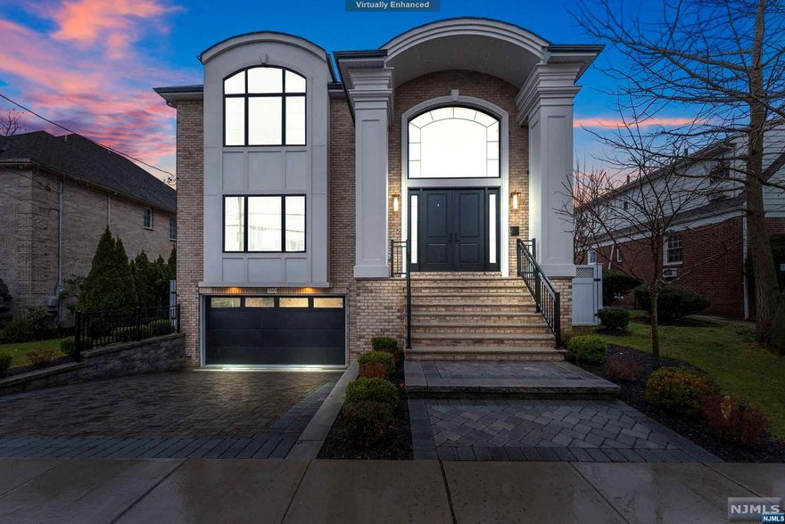 Experience unparalleled luxury in this stunning 6,500 sq ft single-family home nestled in the heart of Fort Lee. Built by Rock Solid, this 3 year old new construction marvel boasts 6 bedrooms, 6.5 bathrooms, and custom molding throughout, exuding timeless elegance at every turn. Bask in the abundance of natural light streaming through the expansive windows, 10-foot ceilings, and state-of-the-art movie theatre. This home is equipped with top-of-the-line upgrades, including a whole house water softening/purification system, a whole house generator, and upgraded speakers with a 4K projector in the theatre room. Outside, you will find a standalone automatic retractable awning, perfect for outdoor entertaining. Don't miss out on this rare opportunity to own a slice of luxury living in Fort Lee. Schedule your showing today!
