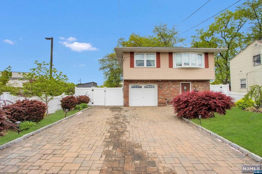 Looking for a move-in ready home? Look no further! We have a beautiful home in Fair Lawn that boasts updates throughout. As you enter the home, you will be greeted by a large, welcoming foyer with access to the garage. The first level also features an expansive family room with doors to the backyard, a laundry room, and a half bath. Moving on to the second level, you will find a spacious living room that opens up to the dining room. The bright and airy eat-in kitchen boasts stainless steel appliances and light cabinets. There are three large bedrooms and an updated full bath that complete the second level. The lush and professionally landscaped property includes a fenced-in backyard and paver patio that is perfect for entertaining. This home is conveniently located close to schools, parks, and much more. Don't miss out on the opportunity to live in this gorgeous home!