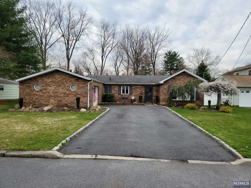 Price Reduction! WELCOME TO EMERSON! Easy one floor living in this pretty ranch. This home is located in a great neighborhood on a quiet street. Entry foyer leads to living room which features dual fireplace that creates a cozy atmosphere in the living room and main bedroom! The house has updated kitchen, spacious dining room, 4 bedrooms, 2 full bathrooms. Walk out your sliding door from your bonus rec room out to the large backyard with pavers surrounding your built in pool! The backyard is great for entertaining with the pool and fire pit! The house is close to shopping and the excellent schools that the town offers. Easy commute to NYC by commuter train or bus. This one won't last! A MUST SEE!!