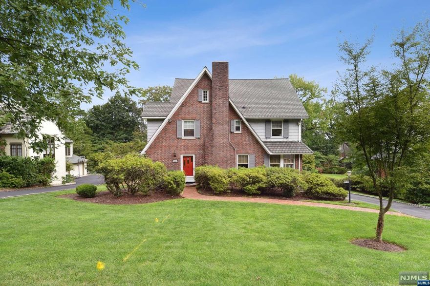 Elegant, spacious and bright Colonial in the desirable Upper Wyoming section of S. Orange. Stately living room with marble w/b fireplace and large windows. Dining room with custom shelving/cabinets flows to LR, FR and Kitchen. Perfect for large gatherings. A grand family room, sure to impress!! Large w/b stone fireplace, raised hearth, vaulted ceiling, wood beams and recessed lighting. An absolute cocoon of sunshine and warmth. Eat-in kitchen with ample custom cabinets, granite counters, prep island and bay windows. Kitchen and family room have access to the large deck with gas grill. Laundry on main floor. Main floor has powder room and sunroom for tranquil moments. Large rooms and hardwood floors throughout. 4 bedrooms on 2nd floor. Primary bedroom has walk-in closet, private bath w/ large stall shower. Hall bath w/ shower over tub serves additional 3 bedrooms. Some hardwood under carpet. All large rooms, great sunlight. Third floor has two additional bedrooms.