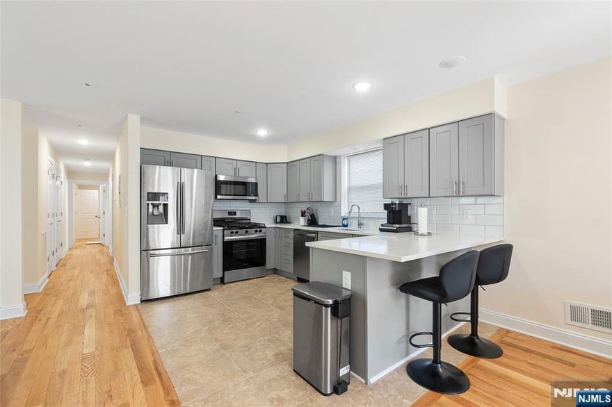 Welcome to this exceptional multi-family home offering 6 bedrooms and 4.5 bathrooms, thoughtfully designed to provide both comfort and versatility for investors and owner-occupants alike. This property features spacious living areas, generously sized bedrooms, and abundant natural light throughout, creating a warm and inviting atmosphere. Step outside to enjoy a private backyard, perfect for entertaining, relaxing, or creating your own outdoor retreat. For added peace of mind and long-term value, the home includes a 10-year builder's warranty along with a 5-year tax abatement, offering significant savings and confidence in your investment. Conveniently located near major highways, public transportation, shopping, and schools, this property blends modern living with everyday convenience.