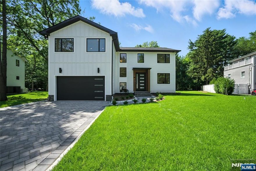 Stunning new construction on a rare, oversized 1/2 acre lot in a prime locationâ€”just a short walk to elementary school, bus, and downtown. This custom-built home stands out with its refined design, elegant finishes, and thoughtful layout. Soaring ceilings and a bright open floor plan enhance the living experience. The main floor features a beautiful white kitchen and a bedroom with a full bath. Upstairs offers four bedrooms, including a Jack & Jill and an en-suite, plus a luxurious primary suite with a spa-like bath and spacious closets. A few steps up is a large bonus room perfect for a playroom, bedroom, or office. The finished basement, built on an existing foundation to help lower taxes, includes a full bath, wet bar, and recreation area. A rare opportunityâ€”homes on lots this size in this location are seldom available at this price.