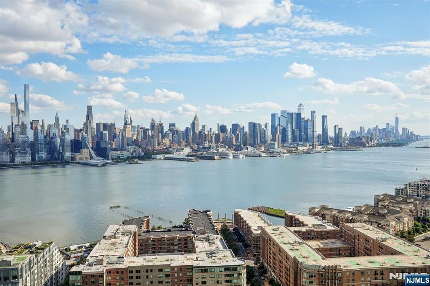 Live above it all in this stunning 3-bedroom, 2-bath corner residence with ~1,850 sq. ft. of living space and an additional 300 sq. ft. private terrace. Enjoy breathtaking, unobstructed NYC and Hudson River views from three exposuresâ€”East, South, and West. The expansive layout features a light-filled living area, beautiful hardwood floors, an open kitchen, and oversized bedrooms with abundant closet space. The primary suite offers a custom walk-in closet and bath. Located in a prestigious full-service building on Boulevard East with 24/7 concierge, fitness center, pool, and on-site parking (fee). Maintenance includes property taxes, utilities, and pool access. Moments from NYC, surrounded by top dining, parks, shops, and moreâ€”this is luxury living at its finest.