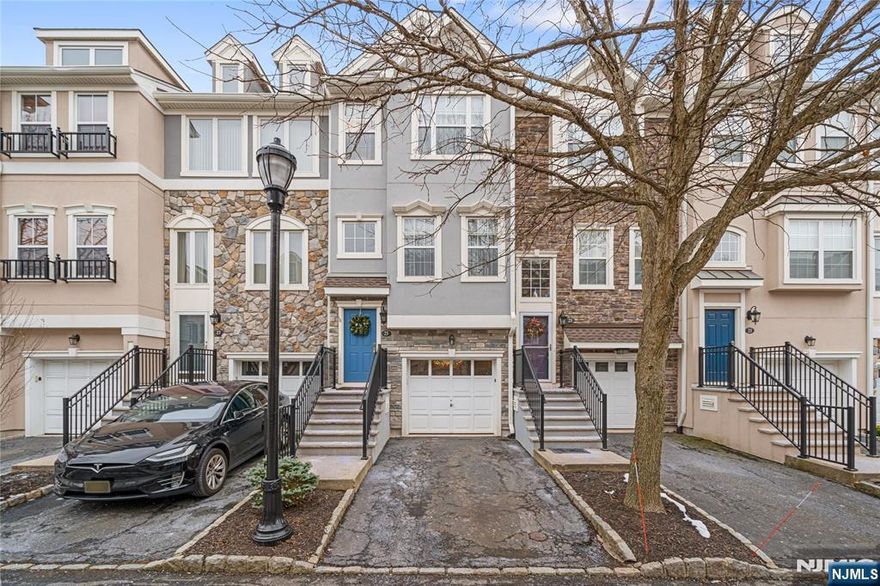 This stunning, completely renovated Londonderry townhouse in the prestigious Cambridge Crossings gated community offers 2 bedrooms, 3.5 baths, and around 2,200 square feet of luxurious living space. The main level boasts a spacious living room, a beautifully updated kitchen with sleek stainless steel appliances, and a dining room that opens to a private balcony perfect for grilling, complemented by a convenient powder room. Upstairs, the expansive primary suite features a fully renovated bathroom and a walk-in closet. An additional generously sized bedroom and a modern hallway bathroom complete the upper level. The ground floor provides an attached garage, a versatile rec room with access to the backyard, and a full bathroom. Residents of this community enjoy a clubhouse, gym, and pool. With exquisite modern updates, abundant space, and a prime location near transportation, shopping, and major highways, this townhouse epitomizes comfort and sophistication.