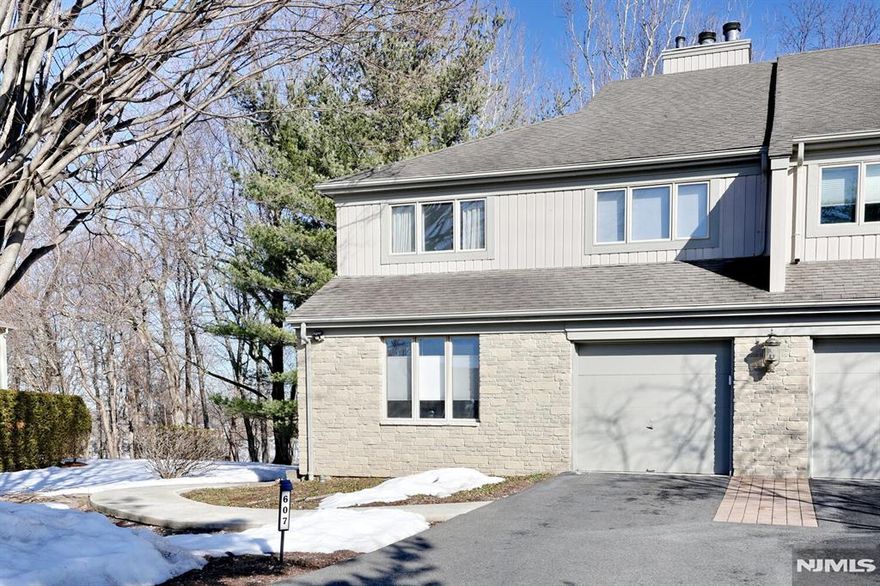 Welcome to 607 Glasmere Rd in desirable Ramapo Ridge. This light filled, well maintained end unit townhome is looking for it's next owner! It is set back off the road and backs up to woods adding to the private setting. Enter into a welcoming entry foyer. Hardwood floors on the first level include a den or home office with French doors, EIK, dining room with deck access, living room with fireplace and a half bath. The second floor also has hardwood floors, two bedrooms and a full bath and a large primary suite with a walk closet and primary bath. The basement is finished and is currently being use as a media room and home office. It also has a full bath, laundry room and loads of storage! Clubhouse, pool, basketball courts, and tennis are right around the corner. Plenty of guest parking. Contact listing agent Barbara Barrosa 772-678-8062 for showing appointments or any questions.