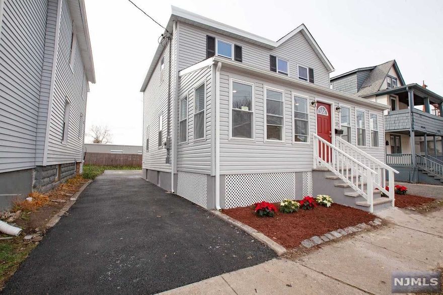 Fully renovated colonial w/ high-end luxury finishes. Move-in ready. Brand new everything. Walking distance to center of town, schools, day-care, yoga studio, coffee shops, restaurants + Seton Hall University. Easy access to NYC transportation. New hardwood floors, designer lighting + freshly painted interior. Brand new open-concept kitchen w/ center island + SS luxury appliances: gas stove, dishwasher in island, refrigerator + microwave; custom solid wood shaker cabinets, QUARTZ countertops, w/ contemporary backsplash. Kitchen opens to large separate dining area. Massive front living room. All new master bathroom on 2nd FL with walk-in closet. Additional full bath on 1st floor. Laundry in basement w/ new washer and gas dryer. All new central HVAC system, new furnace, 2 new AC condensers, new hot water heater. Extra 1st floor bedroom could also become perfect home office. All new windows + siding. New porch w/ tile. Brand new private driveway & driveway. South Orange-Maplewood Dis