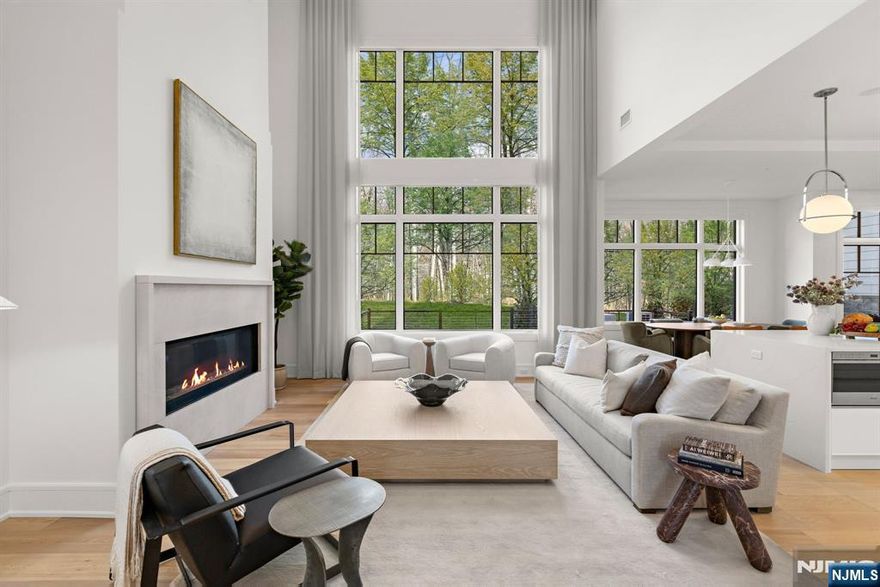 This exclusive, gated enclave of 24 newly constructed townhomes is perfectly appointed with resident clubhouse, fitness center and private pool. Situated amidst 15 serene wooded acres with breathtaking views of the esteemed Alpine Country Club, 22 Stone Bridge Court is a 'Buckingham' floor plan featuring 4 bedrooms, 4.5 baths, elevator and 2 car garage and driveway. Designer Kuche+Cucina kitchen with SubZero & Wolf appliance package, modern spa baths, 10'+ ceilings throughout, whole home generator, air filtration system, smart home technology and much more. Conveniently located minutes from Manhattan, shopping, entertainment and transportation. Developed in collaboration with Zampolin & Associates Architects and Rock Ridge Construction. At The Woodlands, luxury living and natural beauty come together in an unparalleled setting designed for those seeking the finest lifestyle.