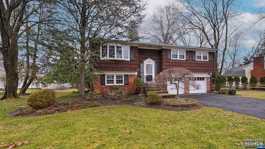 Welcome to this wonderful home in a great location This 4 bedroom 2.5 bath home is in mint condition. There are wood floors throughout the main level, central air, eat in kitchen, glass sliders to deck overlooking a beautiful private level yard. The lower level has 4th bedroom which is currently being used as office. There is a spacious family room with sliders leading to lower level yard, powder room, laundry/utility area and very large two car garage. Minutes to transportation, shopping, restaurants, and major highways 23 and 287. This a must see.