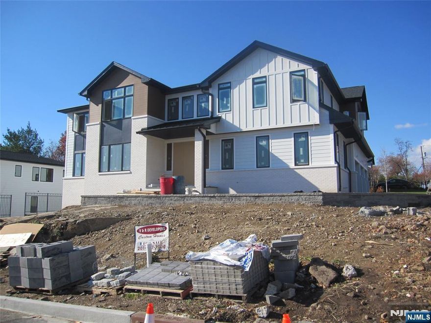 NEW CONSTRUCTION MODERN STYLE. OVER 6799 SQ.FT.OPEN FLOOR PLAN WITH 9FT. CEILINGS ON THE FIRST FLOOR. TWO STORY EF AND FAMILY ROOM WITH FIREPLACE, LARGE KITCHEN/DINING AREA, WITH QUARTZ ISLAND AND COUNTER TOPS, ALL STAINLESS STEEL APPLS, SUB-0 REFRIGERATOR. ALL BEDROOMS WITH EN SUITE BATH WITH RADIANT HEAT. PRIMARY SUITE WITH LARGE BEDROOM, FIREPLACE, LARGE CLOSETS, AND BATH WITH GLASS STALL SHOWER AND FREE STANDING BATH TUB. FIN BASEMENT WITH REC.ROOM, WITH WET BAR, 1 BEDROOM, 1 BATH, MEDIA ROOM. OAK FLOORING, CUSTOMING CEILING AND STAIRWAY LIGHTING, PORCELANOSA TILES, SPEAKER SYSTEM,CAMERA SECURITY, C/AC,VAC, 3 CAR GARAGE, LANDSCAPING, GENERAC GENERATOR. SMART HOME FEATURES, CONTEMPORARY DESIGN, NICE YARD, A GREAT QUIET LOCATION. PREMIER BUILDER, BUILDING LUXURY HOMES SINCE 1981.