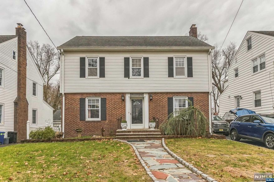 Welcome!!!! You will love this fantastic three-bedroom colonial home is an absolute must-see! Conveniently located in the sought-after section of Livingston, a short distance to Union Train Station with 'EASY NYC COMMUTE,' Features a bright living room with crown molding, a wood burner fireplace, a formal dining room, a kitchen with a center island, recess lighting, dishwasher, sliding door leading to the spacious deck, an enclosed solarium, second floor, three bedrooms with full bath stand-up shower, Finished Attic & Basement with Laundry room, utility room, Central Air conditioning and Radiators for Heat. Exterior Brick Front up the first-floor beautiful landscape driveway, two detached car garages, large fenced-in back yard with Golf Course View