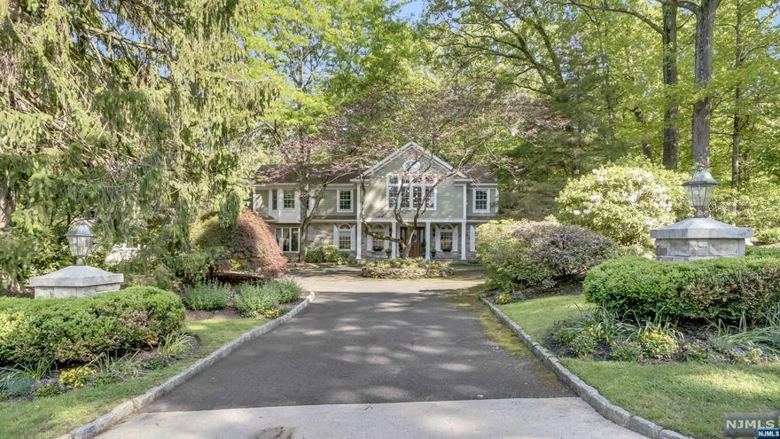 Welcome home to this serene Franklin Lakes Colonial in the sought-after Urban Farms. Beyond grand entry foyer, enjoy an elegant formal living room and a warm inviting family room, both with fireplaces. Next, you will be wowed by the bright designer kitchen with a breakfast area overlooking a park-like backyard. The primary bedroom suite features sitting area, huge walk-in closet, and a gorgeous luxurious bathroom. The second bedroom at the opposite wing with its en-suite bathroom is perfect for in-laws, live-in nanny. A beautiful dining room, classic library, powder room, and a bonus room (currently used as an art studio) complete the first floor. Second floor features three large bedrooms, one with en-suite bathroom and walk in closet, a full bath, bonus room, and walk-in cedar closet. Full finished basement includes rec. room, gym, sauna, yoga room, workshop, tons of storage space. Large deck, in ground Gunite pool, and cabana with a wet bar make for exciting outdoor lifestyle.