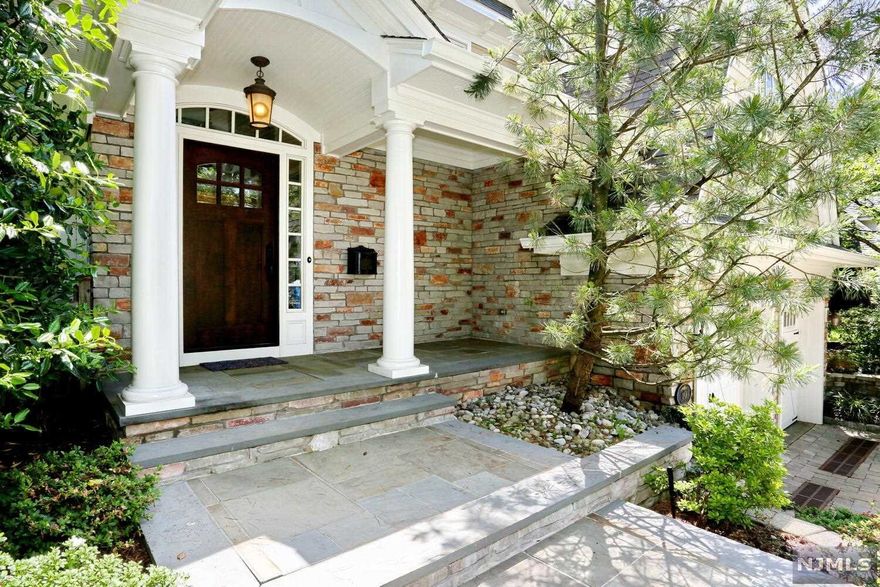 Better than new! This stunning custom designed 4200 sq.ft. contemporary colonial is a great family house in a fabulous neighborhood. Impressive layout offering 5 bedrooms and 4.5 baths (4 en-suites. Master suite with his and hers walk-in closets and fireplace), formal living room, formal dining room, gourmet chef's kitchen with high end Viking appliances, granite countertops and breakfast area for casual dining, great room with wood burning fireplace and wet bar w/doors to private backyard. Lower level is fully finished with 9' ceilings. One of a kind extensive wood trim details throughout and solid doors. Brick & Hardie plank exterior, blue stone patio and tasteful landscaping with cedar privacy fence. 7 zone heat, 2 zone A/C, 2 car oversized heated garage. All this in an excellent town with blue ribbon school system, fine restaurants, and NYC transportation just steps away! Nothing to do, move right in! Owner is a licensed real estate agent.