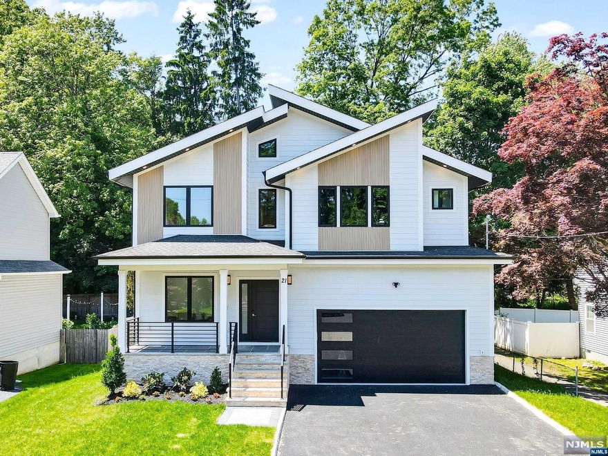 Beautiful 6 BD 5BA Custom Colonial home with approx 4,500 sf of finished living space over 3 floors features a 2-story foyer, gorgeous HW wide plank flooring throughout w extensive trim, custom millwork & finished closets. The home includes a formal Living Room, Dining room, an expansive Kitchen & Family Room with an electric Fireplace. The kitchen is complete with high-end SS appliances, large center island w one-sided waterfall, quartz counters & ceiling-height cabinetry, 1st floor BD for guests, full bath & a Mudroom. The 2nd floor is home to 4 BDs, 3 BAs & laundry including 2 en-suites. The primary Suite is complete w a walk-in closet, spa-like bath w a soaking tub, stall shower & dual sinks. Fully finished walk up basement w bedroom,office playroom, large Recreational Room w built-in bar & full bath. 10-YEAR BUILDER'S WARRANTY