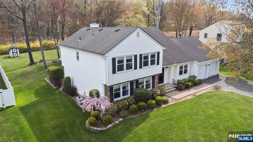 Cherished by its original owner, this beloved home is ready for its next chapter. Tucked in the sought-after Fox Run neighborhood, it offers great curb appeal, excellent value and nearly 1/2 acre of private, park-like property backing to serene woods. Inside, you'll find a sun-filled, spacious layout with beautiful oak floors on the main level. The inviting foyer opens to a generous living room and large family room with fireplace and sliders to a patio overlooking a spectacular backyard oasis. The eat in kitchen, features a charming bay window perfect for morning coffee and flows into a formal dining room ideal for entertaining. Also on the 1st floor: Powder room, large laundry room and bonus space ideal for a walk-in pantry or flexible storage. Upstairs: Four nicely sized B/R's, including the large primary with three closets and ensuite bath, plus a roomy main bathroom. While some updating and personal touches may be desired, the home's generous layout, tranquil setting and quality construction offer incredible potential. A full, high-ceiling unfinished basement has storage galore and awaits your vision for additional living space. Two-car garage. The furnace and water heater are approximately 4 years new. Enjoy space, privacy & endless possibilities in one of East Hanover's most desirable locations. Local highlights: Whippany Railway Museum-seasonal Polar Express Ride, Lurker Park w/walking paths, convenient shopping and entertainment and nearby NJ Transit service to NYC.