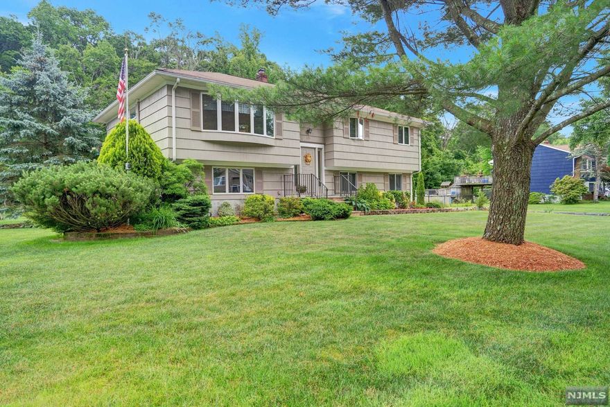 Immaculate 4 bedroom 1 full, 2 half bath Bi-level on a quiet Cul-de sac. This well maintained home is on a level lot, which backs to woods. Central AC, Central VAC, Anderson windows, large private Deck with Retractable Awning, under ground irrigation system, large storage shed. Two car garage with built in cabs and plenty of driveway parking. All you have to do is unpack and go to the grocery store. A quick walk down the street and enjoy a nature walk around Glenwild Lake. Close to downtown Bloomingdale and Rt 287.