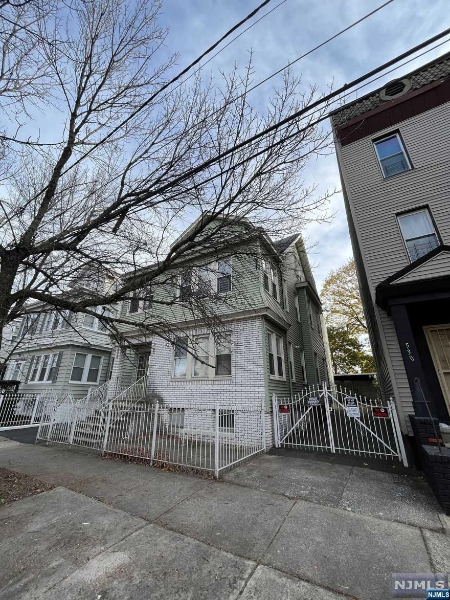 Welcome to 526 S 20th St, Newark, NJ " a fantastic investment opportunity in a thriving neighborhood! This well-maintained 3-family home offers a unique combination of comfort, convenience, and potential income. The first-floor unit is currently vacant, providing an excellent opportunity for the new owner to occupy or lease for additional income. 2nd floor and 3rd floor are rented. The partially finished basement offers a full bathroom and a flexible space, ideal for a recreational area, home office, or additional storage. A rare find in the area, the property includes a four-car garage, ensuring ample parking for residents and guests. Situated close to schools, public transportation, shops, and restaurants, this property offers the perfect blend of urban convenience and residential tranquility. Just 30 minutes away from NYC, making it a commuter's dream with convenient access to major transportation routes.Don't miss out on this incredible opportunity!