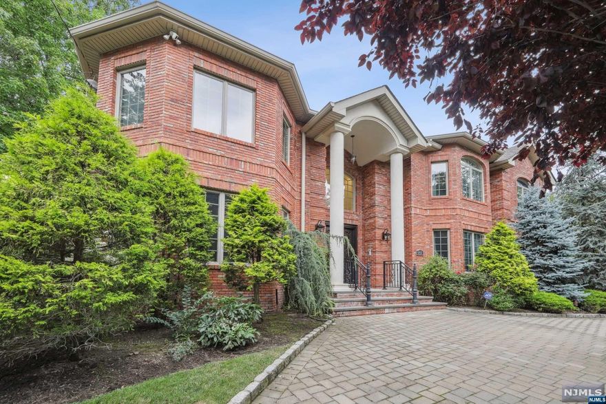 Introducing a true masterpiece of luxury living in the heart of the desired North Cliffs. This exceptional brick manor presents 6 Bedrooms and 6.5 Bathrooms with approx. 7000 sf and a backyard paradise with pool. A dramatic foyer welcomes you to gorgeous open rooms meticulously crafted with custom moldings & elegant built-ins. Brazilian cherry wide plank floors and radiant heat runs through the entire house. Bright and open chef's kitchen with top appliances and butler's pantry connects to the dining rm. The main level also features a formal living rm, great rm, library, guest rm, laundry rm, full bath and powder rm. The 2nd floor boasts a beautiful primary suite and 3 more ensuite bedrms. The lower level is a haven for entertainment with a wine cellar, bar, game room and home theatre. Step outside to your private oasis with a heated gunite pool to unwind or entertain. Only minutes from NYC, this home presents the best of both worlds while offering the low taxes of EC!