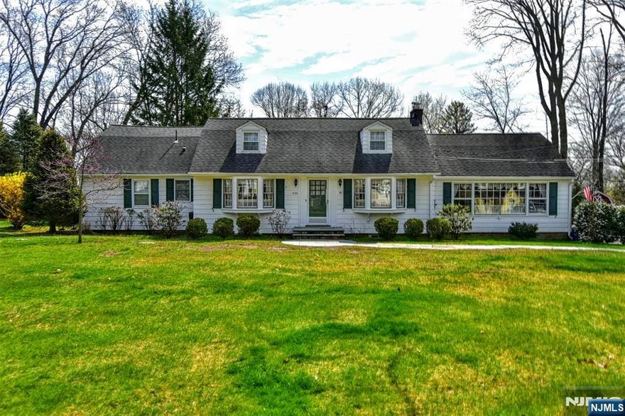 Welcome! Set on over a half an acre of land, make this wonderful Wyckoff home your own! This charming home has 4 bedrooms and 2.5 baths and is filled with warmth, character and opportunity. Thoughtfully updated in key areas and still leaving room for your personal vision. Come on in and see the gleaming hardwood floors as well as all the light that comes beaming through the windows. 1st Floor has the Living Room with Fireplace open to the Dining Room and has the large family room on the other side with the built-in bookshelves. The warm off-white kitchen is inviting and functional with peninsula seating as well as a breakfast room. Don't miss the large walk-in pantry with laundry room! 2 bedrooms and 1.5 baths finish off the 1st floor. On the 2nd Floor, there are 2 oversized bedrooms with many large closets along with a large bathroom. There is amazing expandable opportunities on both sides of the bedrooms. The basement is finished and has a storage area too. The cozy porch on the 1st floor is a great place to spend 3 seasons reading a book or just relaxing. It leads to the composite deck and the new paver patio that overlook the private backyard. A little gate in the backyard leads to the street behind the property for neighborhood walks and play for all! Come see!! This is a special opportunity. Home being sold "as is" with no known issues.