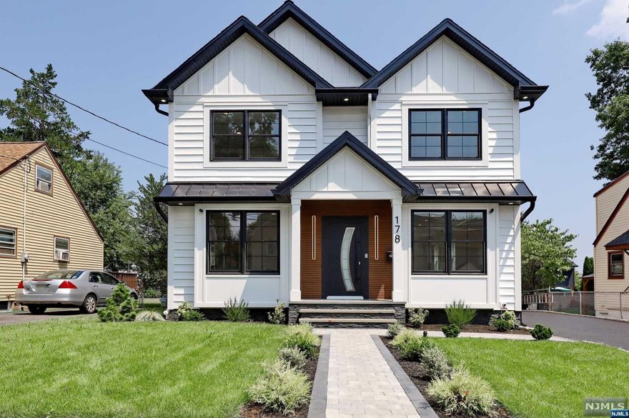 Stunning new construction home on old foundation. Open concept layout offers eat-in kitchen with center island, top of the line ss appliances and quartz countertops, overlooking the dining room and living room with electric fireplace. First floor bedroom with custom closets, perfect for home office or guest bedroom, full bathroom. Upstairs the primary bedroom suite with primary bathroom, 3 additional bedroom and full bathroom, laundry. Finished basement with rec room, half bathroom and utility room. Pavers patio and 1 car detached garage. House with many upgrades including heated bathroom floors, central vacuum, camera system, tankless heater system etc. Conveniently located near NYC transportation, major highways and shopping.