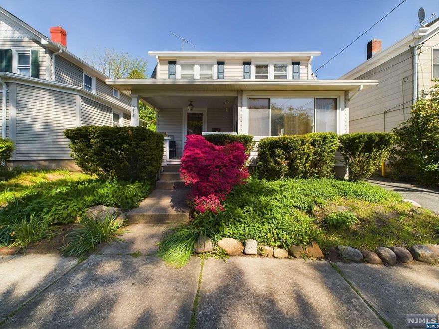Welcome home to this charming, well-maintained colonial with a front porch oasis & tons of living space. Oozing 1920's charm, high ceilings, lots of light and stunning hardwood floors throughout. This home was crafted to allow for a seamless flow from room to room, perfect for entertaining! The first floor features a large entry foyer leading into a living room with beautiful built-ins, sunroom with tons of windows & light, family room and a dining area that opens to an updated kitchen with stainless steel appliances and granite countertops. An updated full bath completes the first floor. Upstairs you will find a gorgeous primary bedroom with lots of closet space and vaulted ceilings, three generous sized bedrooms and a full bath (SOT). Walk-up, finished third floor would make for a great playroom, office or storage space. Private, flat backyard with patio and two car garage. Conveniently located to all Midland Park has to offer!