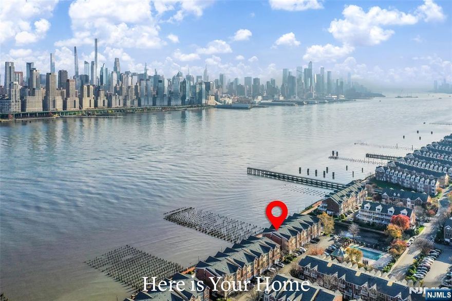 Ready to Move in!! Experience luxury waterfront living in this stunning 3 bedroom, 2.5 bath townhouse in Jacobs Ferry community. The main living area showcases breathtaking, unobstructed Manhattan skyline through expansive windows, creating a dramatic and inspiring backdrop to daily living. The home features elegant Brazilian hardwood floors throughout, designer lightings, Sub-Zero refrigerator, and brand new custom cabinet doors. A rare and exceptional feature is the private in-unit elevator, offering convenience and ease across all levels. The spacious and bright open-concept layout seamlessly connects the kitchen, dining, and living areas, making it ideal for entertaining or simply enjoying the spectacular views. The bedrooms are generously sized, including a serene primary suite with ample closet space and a well-appointed bathroom. Located just behind the home are the community swimming pool and playground, perfect for relaxation and recreation. Commuting to New York City could not be more convenientâ€”enjoy the free community shuttle to the Ferry and Light Rail, or simply walk to the NJ Transit Bus 158, providing direct access to Port Authority. Additional amenities include beautifully landscaped grounds, waterfront walkways, and easy access to shopping, dining, and parks.