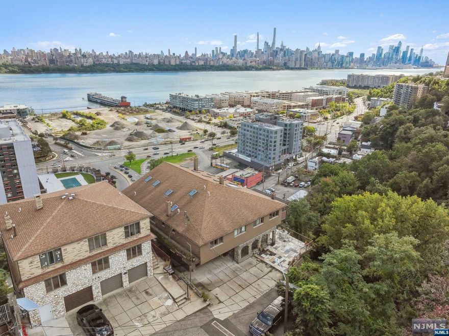 Your dream home is waiting for you! This location is one of the best in town at the end of the street with unobstructed views of NYC and full wraparound porches on all 4 levels. This is a custom-built home with craftsmanship stonework throughout the property and includes 9 bedrooms with 10.5 bathrooms. This property can be sold for single use, but is zoned as a two family dwelling. There is an option to convert it to a three family with modifications. There are separate utilities, two fireplaces, a 2 car garage (which can be expanded), parking for 4 cars, laundry , central air, 2 fireplaces, and an option to add an elevator. Other features include enclosed porches with NYC views, steel beam/concrete foundation, and skylights throughout the top floor. There are 3 gas meters, 3 electric meters, and 1 water meter. Bottom floor features an owners unit customized with a sauna and option to put an in-ground pool. Schedule your private tour today!