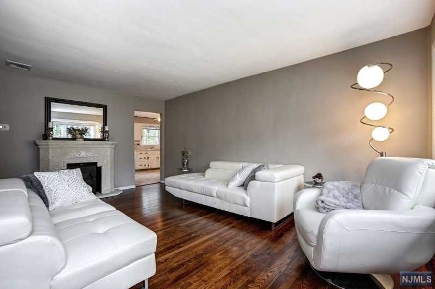 PHENOMENAL and best deal in Rahway! Hardwood floors, new windows, forced hot air, central air, attached garage and so much more. This is everything you've been looking for and more. THIRD bedroom currently being used as dining room but can easily be converted back to bedroom. Come turn this house into a home before someone else does!