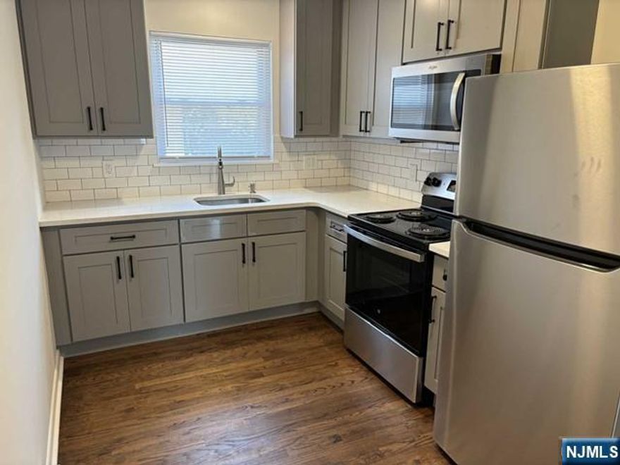 Stunning renovated 2nd Floor apt! Refrigerator and microwave included. Hardwood floors, close to public transportation and shopping. One off-street parking space provided. No pets. Landlord has NJ real estate license. Listing agent related to landlord.