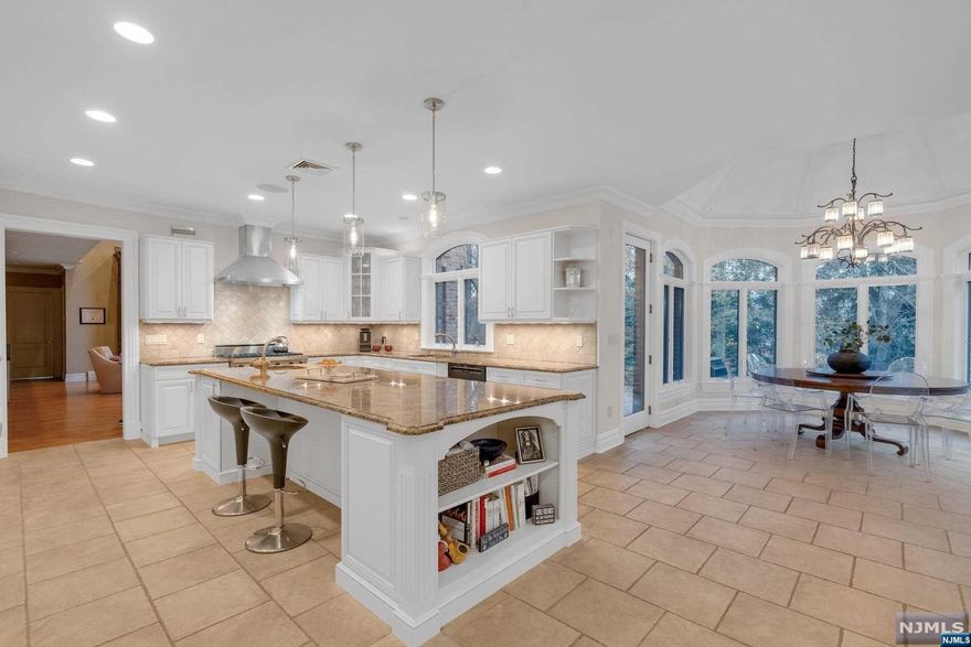 GLEN CARL, meticulously crafted by the esteemed builder, Kevo Construction, rests gracefully on a sprawling 1.06-acre.Nestled within a serene cul-de-sac,this brick home,over 6100 SF,emanates an aura of refined elegance.Impressive two story entry leads to the eqaully striking great rm, showcasing floor to ceiling windows that flood the space with natural light, anchored by a handsome cherry fireplace. First flr is thoughtfully designed, comprising a gourmet kitchen w/SS high-end appliances, eat-in area, Butler's Pantry, mudrm & full bath. There is an elevator/3 flrs, office/en-suite bedrm,formal LVG &DR rms. Second flr reveals a sumptuous prim. suite,w/a sitting rm,dual-sided FPL & 4walk-in closets. Three more en-suite oversized BRs w/custom closets complete this flr. The outdoors is a private sanctuary, w/an oversized pool w/Jerusalem stone deck.Oversize 3car heated Garage. Glen. Carl represents the pinnacle of lux living,where architectural excellence & tasteful design converge!