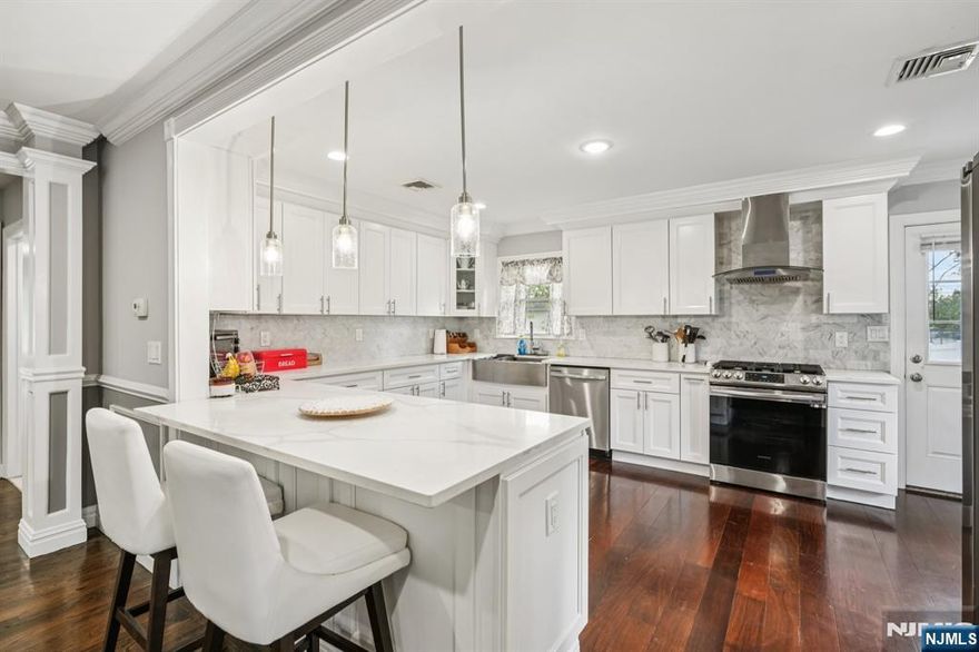 Discover this beautifully renovated and impressively spacious home in the sought-after community of Northvale, NJ, right on the Norwood border. Set on a generous 150x122 lot within the highly acclaimed Northern Valley School District, this home offers exceptional comfort, style, and convenience. From the moment you arrive, youâ€™ll appreciate the two-car garage, a wide paver driveway with easy turnaround, plus an additional side driveway perfect for extra parking. Inside, the first floor features an open living area with a cozy fireplace, a stunning chefâ€™s kitchen with quartz countertops, stainless steel appliances, and direct access to the patio. The primary suite features a renovated bathroom, walk-in closet, and a walkout to a private back deck. Youâ€™ll also find a bedroom with its own ensuite and walk-in closet, a third bedroom, and a gorgeous renovated main bathâ€”all with easy access to the deck for indoor-outdoor living. The fully finished lower level offers a spacious entertaining area, a guest room with a walk-in closet, a full bath, a brand-new washer/dryer, and walkout access to the backyard. The property is fully enclosed with new vinyl fencing, featuring a large yard, back deck, and side patioâ€”ideal for gatherings. Additional upgrades include custom molding, a new water heater, central AC, and excellent sound insulation. Proximity to just about everything!