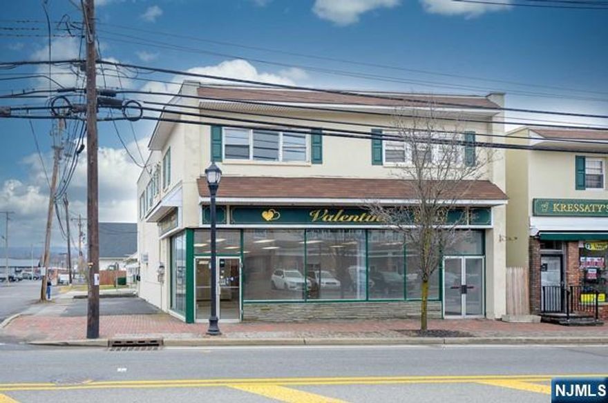 Three unit mixed use building in the heart of Wanaque. Downstairs a retail storefront (currently vacant) with two front entrances, a front "showroom" area, two offices and two half baths. Access to the unfinished basement with tons of storage and a lift to get product up and down the stairs. Ample parking spaces and on-street parking. Two apartments upstairs with separate entrances. A one bedroom, one bathroom apartment with kitchen and living room and a two bedroom one bathroom apartment with kitchen and living room - both currently rented. Close to 287. All utilities separate.