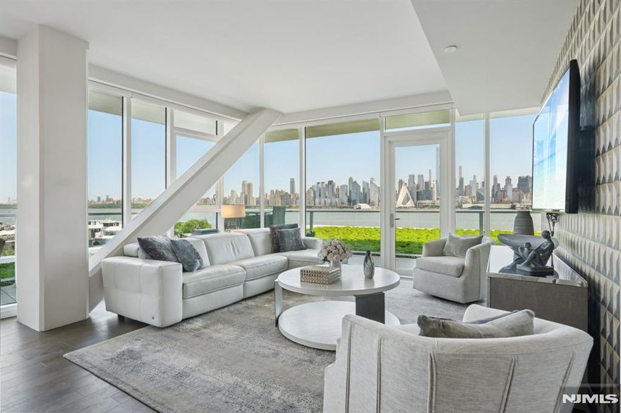 Experience refined waterfront living in this prestigious end residence at Avora at Port Imperial. This professionally designed, luxury model home features 3 bedrooms, 3 full baths, and approx. 1,828 sq. ft. of open living space. An expansive wraparound patio offers over 400 sq. ft. of private outdoor living, surrounded by a green roof that creates a tranquil riverfront ambianceâ€”perfect for relaxing or entertaining. The modern kitchen is appointed with European-style cabinetry, Quartz countertops, and premium KitchenAid stainless steel appliances. Hardwood flooring flows through the main areas, while the spa-like baths are finished with elegant Italian porcelain. Custom closets and abundant storage throughout. Includes 1 garage parking space. Enjoy Avoraâ€™s resort-style amenities: a 3rd-floor sundeck with outdoor pool and BBQ grills, fitness center, steam and sauna rooms, media room, golf/sports simulator, resident lounge, business center, and 24-hour concierge. Ideal location with easy access to NY Waterway Ferry, Light Rail, and NJ Transit Bus. Luxury, comfort, and convenienceâ€”all in one breathtaking riverfront residence.