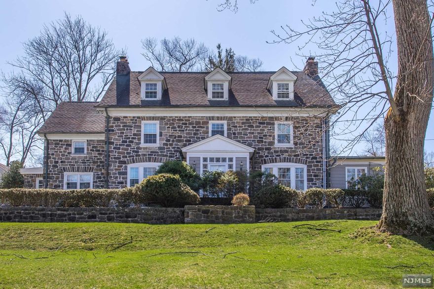 Elegant & Grand this Magnificent Stone Colonial is Situated on a Gorgeous 1.4 Acre Lot in the Heart of Essex Fells! Features include: Grand Foyer Entry, Two-story Great Room, Master Suite w/Dual Walk -in Closets and Full Bath (Stall Shower and soaking tub), Large Finished Basement, Apartment above Three Car Garage (perfect for au pair suite)! Four Levels of Living (Including the Finished Basement). Must See!