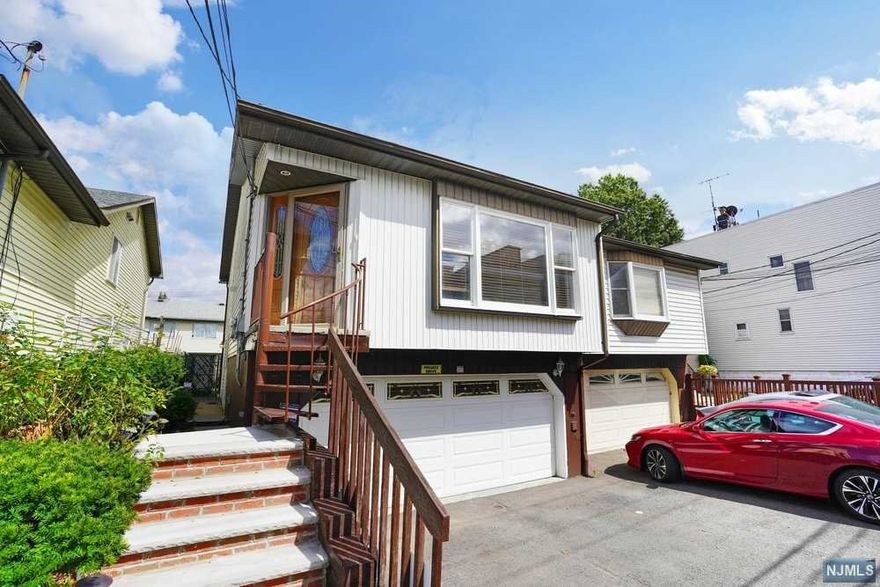 Move in Ready! Unique opportunity to purchase this well maintained two family home from the original owners. Just blocks away from Country Village, this home is a perfect opportunity for owner occupants or investors. The main level features hardwood floors, newer kitchen with granite countertops and stainless steel appliances and direct access to an attached two car garage and laundry area. The renovated second unit with private entrance features newer kitchen and bathroom. Close to highways, public transportation, shopping & places of worship.