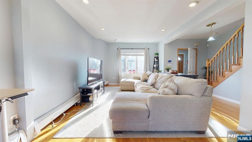 Welcome to this beautifully maintained 3BR/2BA Colonial on a quiet dead-end street at 29 Long Ave in Hillside, NJ. Hardwood floors and recessed lighting are throughout. The lower level includes a finished basement with a private entrance and a second kitchen offering great potential for extended living for guests. Enjoy a private fenced backyard with a large storage shed. Updates include a new roof and front siding (2024). This spectacular home is conveniently located just 8 minutes from Newark Liberty International Airport.