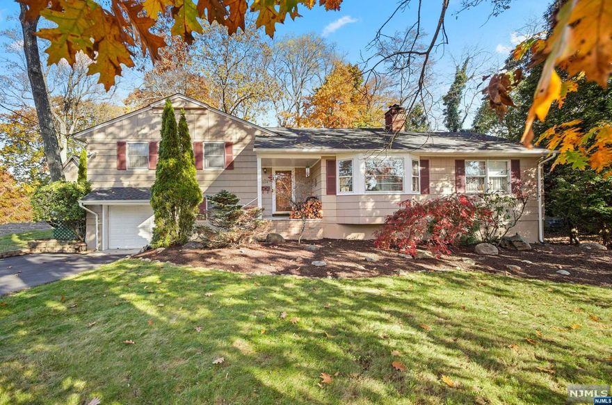 Welcome to Ramsey! You will find an open-concept, first-floor primary retreat and exceptional yard in this charming 4-bedroom split level. Off the entry there is a spacious living room with a wood burning fireplace. This flows into an open-concept kitchen and dining room that features stainless steel appliances and granite counters, creating the perfect gathering space for entertaining. On this floor you will also find an expansive primary retreat with a walk-in closet and primary bath. Upstairs there is what could be a second primary bedroom with an ensuite powder room, 2 additional bedrooms and a hall bath. On the lower level you will find a useful family room/den, a laundry room and access to an attached garage. The large deck and vast private yard create a private retreat. Conveniently located to highways, schools and transportation. This home is not to be missed! WANT MORE INFO? CONTACT LISTING AGENT NICOLE MINETTI @ 201-388-0077 or nicole@minettidennisgroup.com