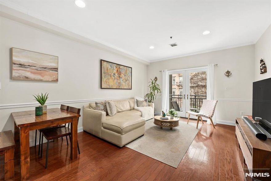 Private balcony and parking set the tone for this spacious 2-bedroom, 2-bath home in an elevator building in Hobokenâ€™s desirable southwest cornerâ€”just one block from the new Dumbo Market and a few blocks to the PATH. The open kitchen features granite countertops, custom cabinetry, and stainless steel appliances, flowing seamlessly into generous living and dining areas ideal for everyday living or entertaining. The primary suite includes a large walk-in closet and en-suite bath, while the second bedroom easily fits a king-size bed. Additional highlights include hardwood floors, central air, in-unit washer/dryer, fitness center, and parking.