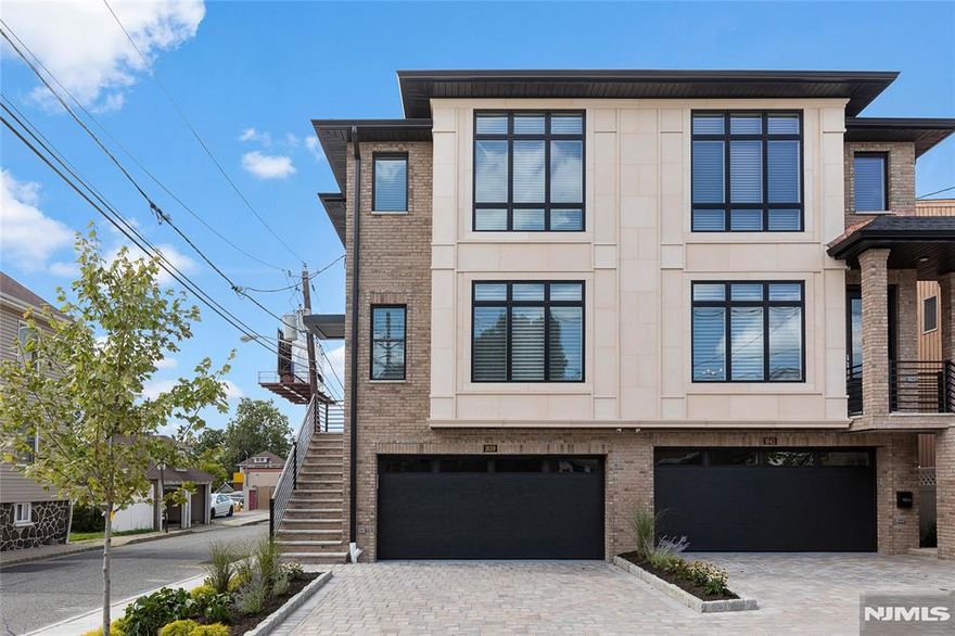 Built in 2019, this modern 3 bedroom, 2 full, 2 half bath townhouse offers high-end living with a spacious floor plan in a desirable Fort Lee location. Nearly 3,000 square feet and 3 floors of living space. State of the art finishes including Anderson windows, modern Kitchen with custom cabinetry, quartz counters, stainless steel appliances (including additional dimchae kimchi fridge and wine fridge), walk in pantry and sliding glass door to outdoor patio with Weber grill. Open concept living/dining room with gas fireplace, speaker system and hardwood floors throughout. Radiant floor heating in all bathrooms and 500 sq. ft. finished basement. Wired surveillance system, central vac and all window treatments remain. Solar panels offer reduced utility bills. Lots of closet space throughout. Ground floor with attached 2 car garage, mud room and family room with access to private backyard. Corner lot. 5 minutes to NYC transportation.