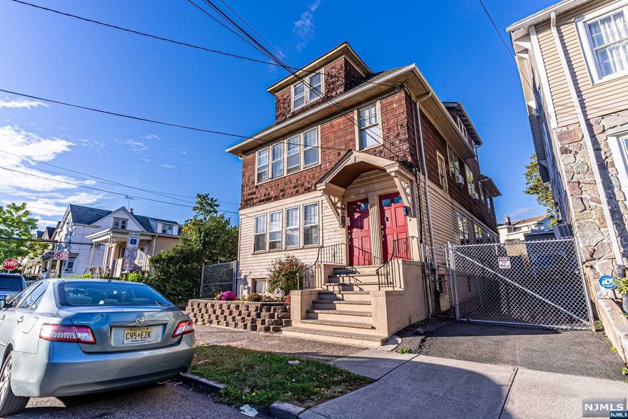 Welcome to this spacious 2.5 family home nestled in a tranquil neighborhood, where modern living takes center stage. This property features an intriguing bonus 3rd unit with its private entrance, unlocking additional income potential or flexible living space. Just moments from Route 80, it offers proximity to top schools, diverse dining options, and everyday essentials. With a 3-car garage, and a partially finished basement, this property is your canvas for endless possibilities. Step into the world of modern living and seize the opportunity to make it yours.