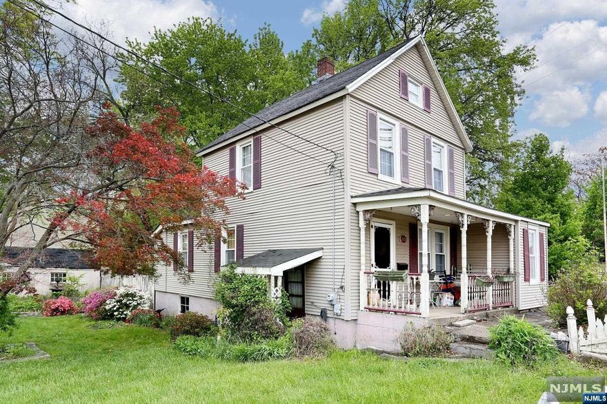 Charming Colonial style home. Featuring a Bright living room, den/office with French doors, eat in kitchen, dining room and full bath complete the first floor. Two nice size bedrooms are on second floor. Large outdoor deck leads the double lot property. One car garage and paved driveway. This home has great potential to add your personal updated touch. Located in convenient area near schools, shops and transportation. Laundry has been relocated to the first floor. Basement is unfinished/storage use. This home is AS IS sale.