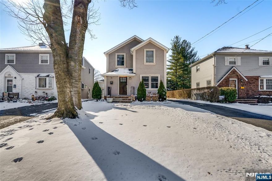 This stunning two-story stucco-front home boasts timeless elegance and modern amenities. Featuring 3 bedrooms, 2.5 bathrooms, and a 2-car detached garage, this property offers comfort and style at every turn. Step inside to find hardwood floors throughout, a gourmet kitchen equipped with stainless steel appliances, granite countertops, and a marble backsplash perfect for entertaining and culinary creations. Adjacent to the kitchen is a charming dining area with convenient access to the backyard. The spacious living room is beautifully appointed with custom crown molding, recessed lighting, a half bathroom, and a coat closet for added convenience. Upstairs, the second floor hosts three bedrooms, including a serene master suite with its own private bathroom, as well as a second full bath to serve the additional bedrooms. The full finished basement offers tiled flooring, a laundry area, and space for utilities ideal for recreation or additional storage.