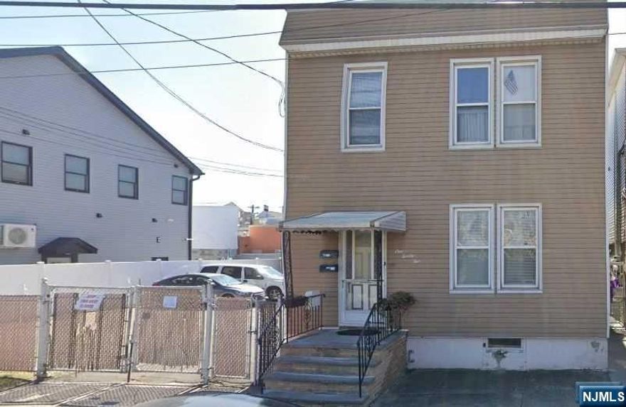 Two Family on Oversized Lot! Possible Sub- Division. Each floor offer Living Room, Kitchen, 3 Bedrooms, Full Bath, Unfinished basement. Parking for 4 Cars. Lot is approximately 62.6 X 104.6