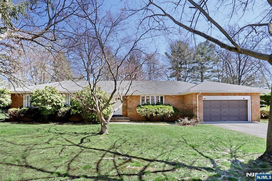 Modernized Ranch with Sunken Living Room & PRIVATE GATE to Van Saun Park! Experience a unique architectural layout on a 12,647 SQFT FLAT LOT (No Flood) in a quiet cul-de-sac. This meticulously maintained 4BR/3.5BA, 2,022 SQFT home with a FINISHED BASEMENT features a 2-CAR GARAGE and a rare PRIVATE GATE leading directly into the park, your own extended backyard! The main level offers a bright open flow. Enjoy a NEW KITCHEN (04/23) with a wall removed to overlook the stylish Sunken Living Room, a formal dining area, and 3 spacious bedrooms including 2 NEWLY RENOVATED BATHROOMS (07/24). The PRIVATE-ENTRY 1BR/1BA WING with kitchenette is ideal for guests, an in-law suite, or a home office. NEW ROOF (06/23) and NEW FENCE ALONG THE PARK SIDE (08/24). The property also features a massive layout offering endless possibilities, a perfect canvas to add your personal touch and custom finishes. Electric heating throughout is perfect for a future solar conversion (gas conversion also available). PRIME LOCATION: Walk to Middle/High Schools. Easy access to Rt 4, 17, GSP, Manhattan bus, and world-class shopping.