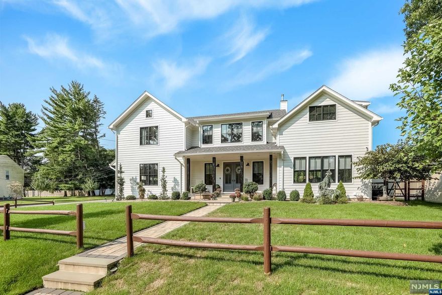 Three years young farm house colonial in amazing location of Old Tappan close to Blue Ribbon schools. The EF offers a sitting room with elec fplc & herringbone flooring. Custom kitchen offers quartz countertops, SS appliances, & large island with full sink & seating for 6. The kitchen opens up to the coffered ceiling great room w/ custom hand built cabinetry (also in kitchen & mudroom), wood burning modern fireplace, & large 16 ft SGD leading to trex deck that showcases a custom vertical garden wall, double retractable awnings, and gas firepit integrated into deck. Second level primary bedroom w/ luxury full bath featuring double vanity & soaking tub in shower. Bonus room on 2nd level is ideal for entire family-gym, playroom, movie theatre, or possible office. Cathedral ceiling in bdrms. Fully finished lower level includes 6th bedroom, full bath, & summer kitchen. Radiant heating on ALL levels including 3 car garage and foam insulation throughout. High level finishes.