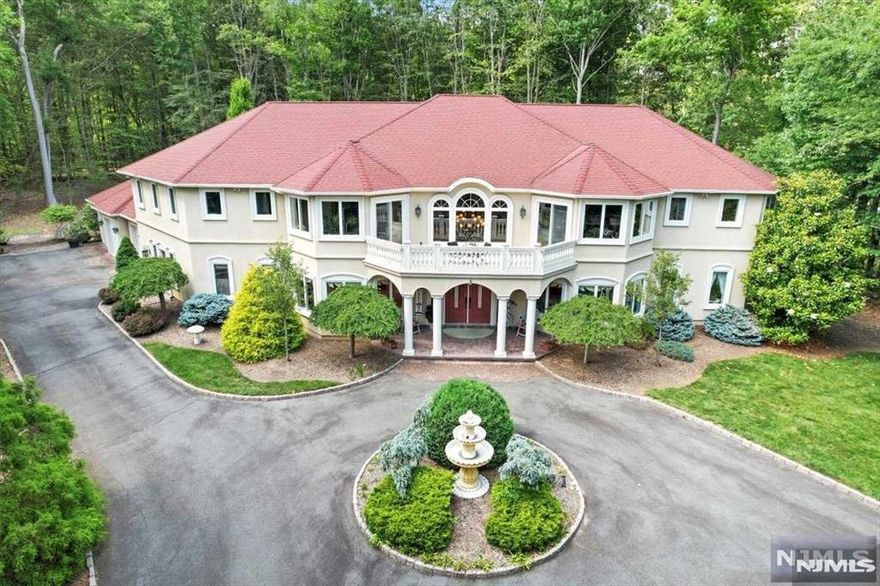 Welcome to this exquisite estate, boasting approx 6,000 sqft of luxurious living space on nearly 1.5 acres of private, serene land. This magnificent home features 6 grand bedrooms, including 2 primary suites, and 6 lavish bathrooms adorned with stunning tile details and jetted showers. Awaken each day in your personal oasis, swim laps in your private pool, and enjoy culinary adventures in the state-of-the-art kitchen equipped with 3 sinks, 2 refrigerators, a coffee bar, and a 6-burner Viking range. Entertain guests in your exclusive wine room, perfect for hosting unforgettable evenings. This residence is designed for celebrating life's precious moments in unparalleled elegance and style. Don't miss this opportunity. WANT MORE INFO? CONTACT LISTING AGENT NICOLE MINETTI @ 201-388-0077 /nicole@minettidennisgroup.com