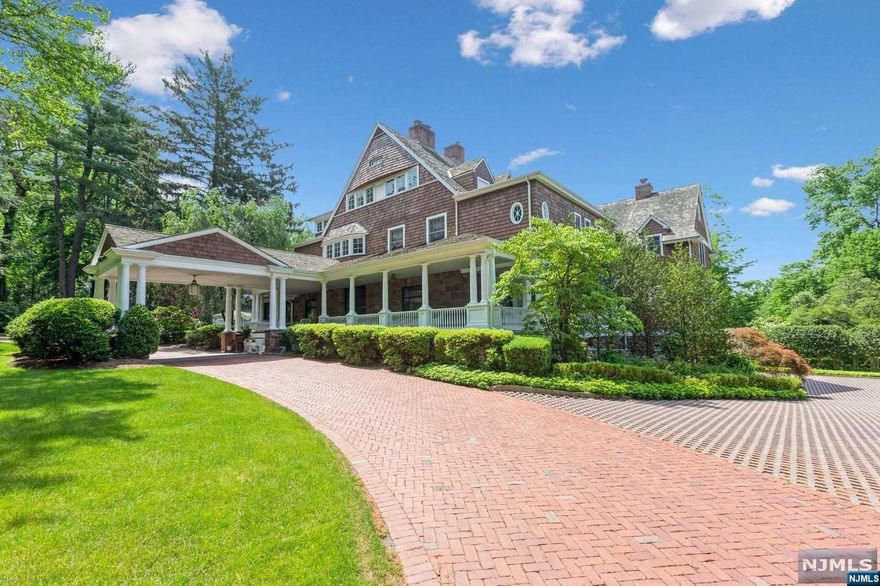 Rarely available one of kind Cedar and Stone Manor home set on 1.65 Acres on Englewood's East Hill. In the past decade the home was redesigned and expanded by James Paragano in a seamless, no expense spared renovation. Every detail was carefully thought through ,not only to restore the original grandeur of the dwelling but also have the conveniences of today's cutting edge technology. The main contains 7BR'S(Ea is a suite)10.1 baths,elevator to all levels,grd foyer,grd LR,FML DR,linestonefireplaces,hardwood floors,Frch DRS,smart home technology and a finished lower lvl w/spa,wine cellar,billardsrm,gym and more. The Ktch is oversized with marble ctrtops and isle,chry cabinetry and features La Cornue and Sub-Zero appliances. In addition there is a carriage house and for car enthusiasts ,garaging for up to 8 cars. Otdrs find a majestic pool w/electric car and spa as well as lushly landscaped grounds with interior gardens and fountains. Dont miss the opportunity to own this fine home.