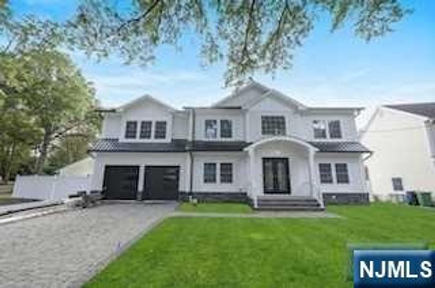 Stunning new colonial, approximately 3,750 sq.ft. with an additional 1,100 sq.ft. finished basement. 6 bedrooms, 4 full and 2 half bathrooms. Grand 2 story entry, formal living and dining room. Spectacular kitchen, 1/2 bath, open concept great room with a fireplace and dry bar. First floor bedroom w/private bathroom. Mud room leads to 2 car garage. Upstairs you will find a huge Primary bedroom w/fireplace, his and her walk-in closets, and luxurious bathroom. Two bedrooms w/Jack and Jill bathroom, 2 additional bedrooms, hall bathroom and laundry room complete this level. Expansive finished Basement offers a Theatre/Media room, space for Gym and Entertainment. Features include cement board siding and stone exterior, impressive moldings and craftsmanship, multi zone heat and AC, Fenced private yard, ideal location with close proximity to schools, parks, library, NYC transit bus and train. Make it a Happy New Year in this beautiful home!