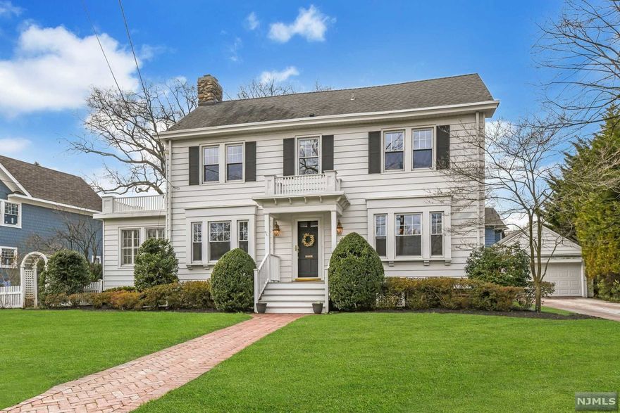 Move right into this charming and classic center hall Colonial in the heart of the prestigious Ridge School district. This 5 Br beauty boasts a sun drenched dining room, gracious living room w wood burning fireplace, and bright family room w french doors leading to patio. Gorgeous modern kitchen w quartz countertops, stainless steel appliances, adorable powder room and laundry. On the second floor you'll find a master suite w ample closets, stunning carrara marble bath, and two generous bedrooms that share a lovely hallway bath. The third floor has two additional bedrooms and full bath. Meticulous landscaping throughout the yard including arbor, Boston brick patio and driveway and private rear yard. Brand new hardwood floors throughout, finished basement, 2 car garage and more! Don't miss out on this wonderful opportunity!