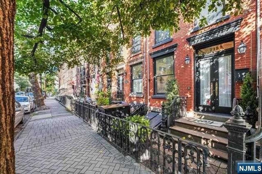 Nestled on a charming tree-lined street in the heart of Hoboken, this extraordinary single-family home will captivate you with its blend of historic charm, modern sophistication, and timeless beauty. Upon entering, you'll be greeted by a beautiful open living space spread across multiple floors. The layout is designed to provide both comfort and functionality for modern living. The interior seamlessly blends custom renovations with original architectural details. Gleaming hardwood floors, original moldings, and exquisite decorative fireplaces with marble mantles have been preserved, infusing each room with character and warmth. The gourmet kitchen is thoughtfully designed with an abundance of custom floor-to-ceiling cabinetry and exceptional details including toe kick pet bowls, quartz countertops, an expansive island, a Sub-Zero fridge, farmhouse sink, brass hardware and fixtures- a perfect space for culinary creativity and entertaining.